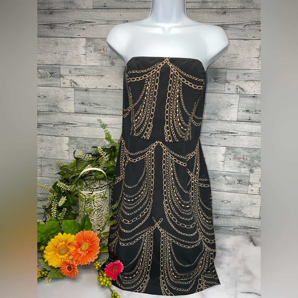 Corly size 4 strapless lined silk dress.